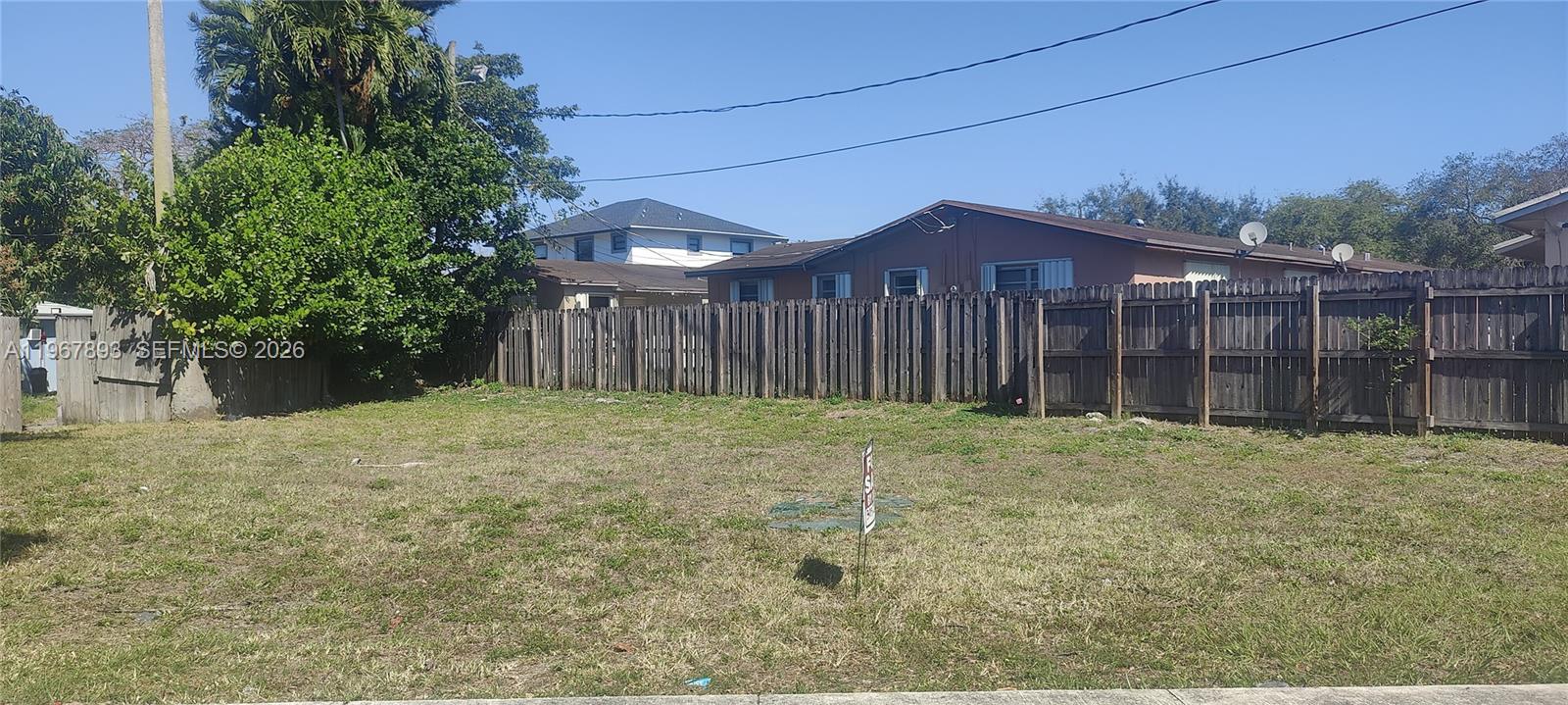 5825 Fillmore Street Hollywood, FL 33021 - Photo 2 of 6 a house with trees in front of it