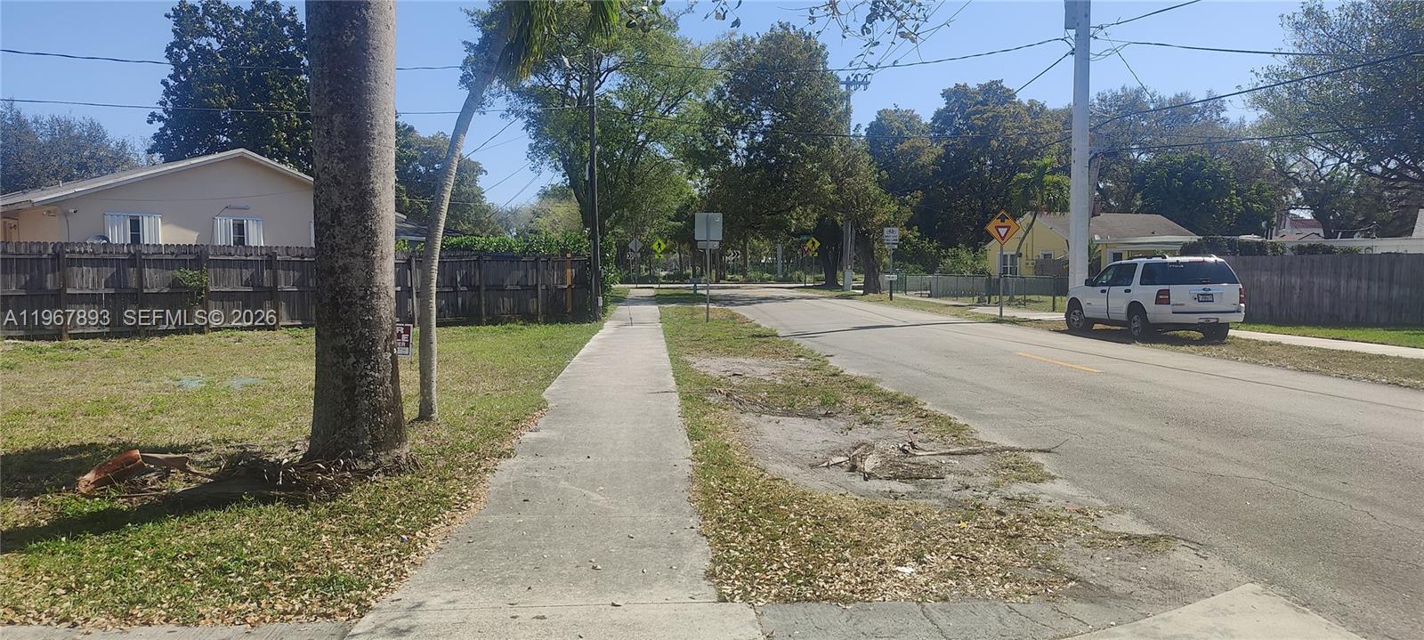 5825 Fillmore Street Hollywood, FL 33021 - Photo 6 of 6 a view of a street with a house in the background