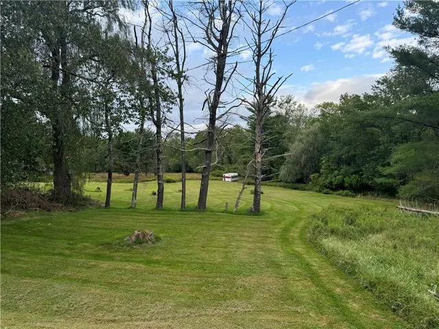 a view of a golf course with chairs