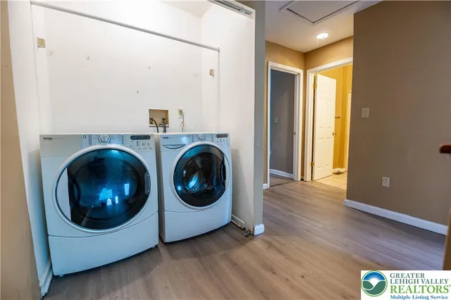 a view of a hallway with washer and dryer