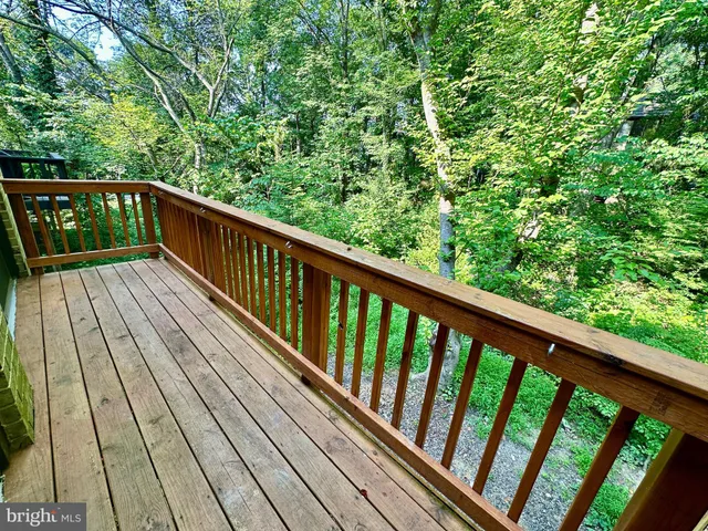 a view of balcony with wooden floor