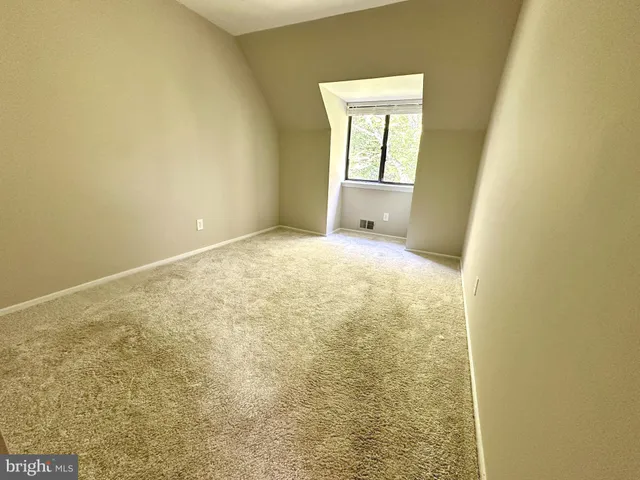 a view of a room with a window