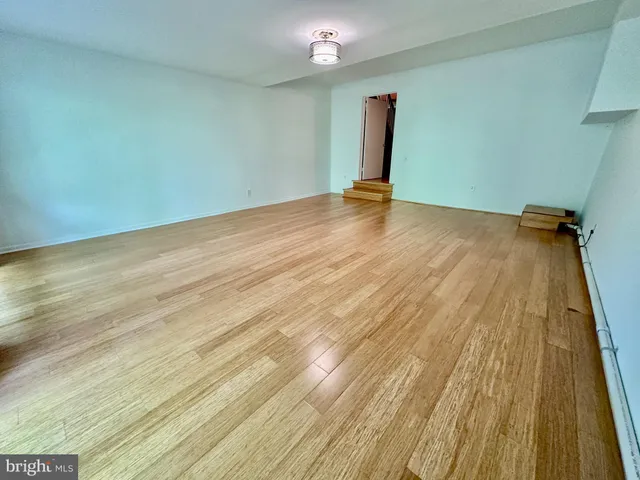 a bathroom with a sink mirror and toilet