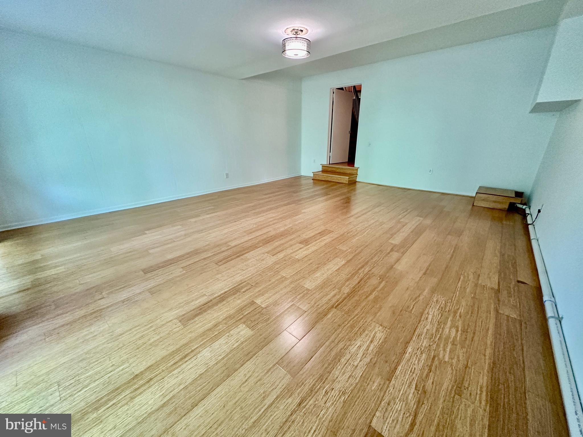 1526 Scandia Circle Reston, VA 20190 - Photo 24 of 29 a view of an empty room with wooden floor