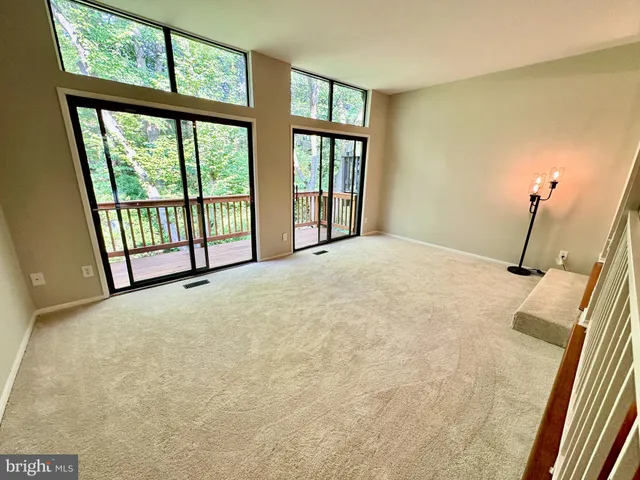 a view of a room with large windows