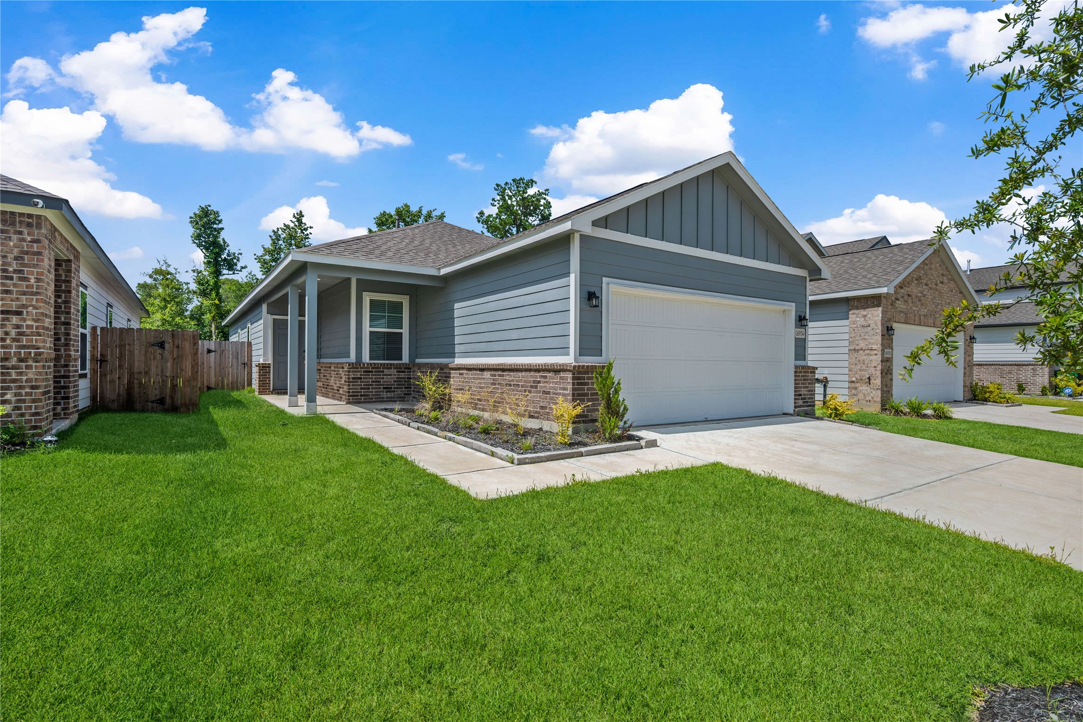 16934 Needlepoint Drive Conroe, TX 77302 - Photo 2 of 24 a front view of house with yard and outdoor seating