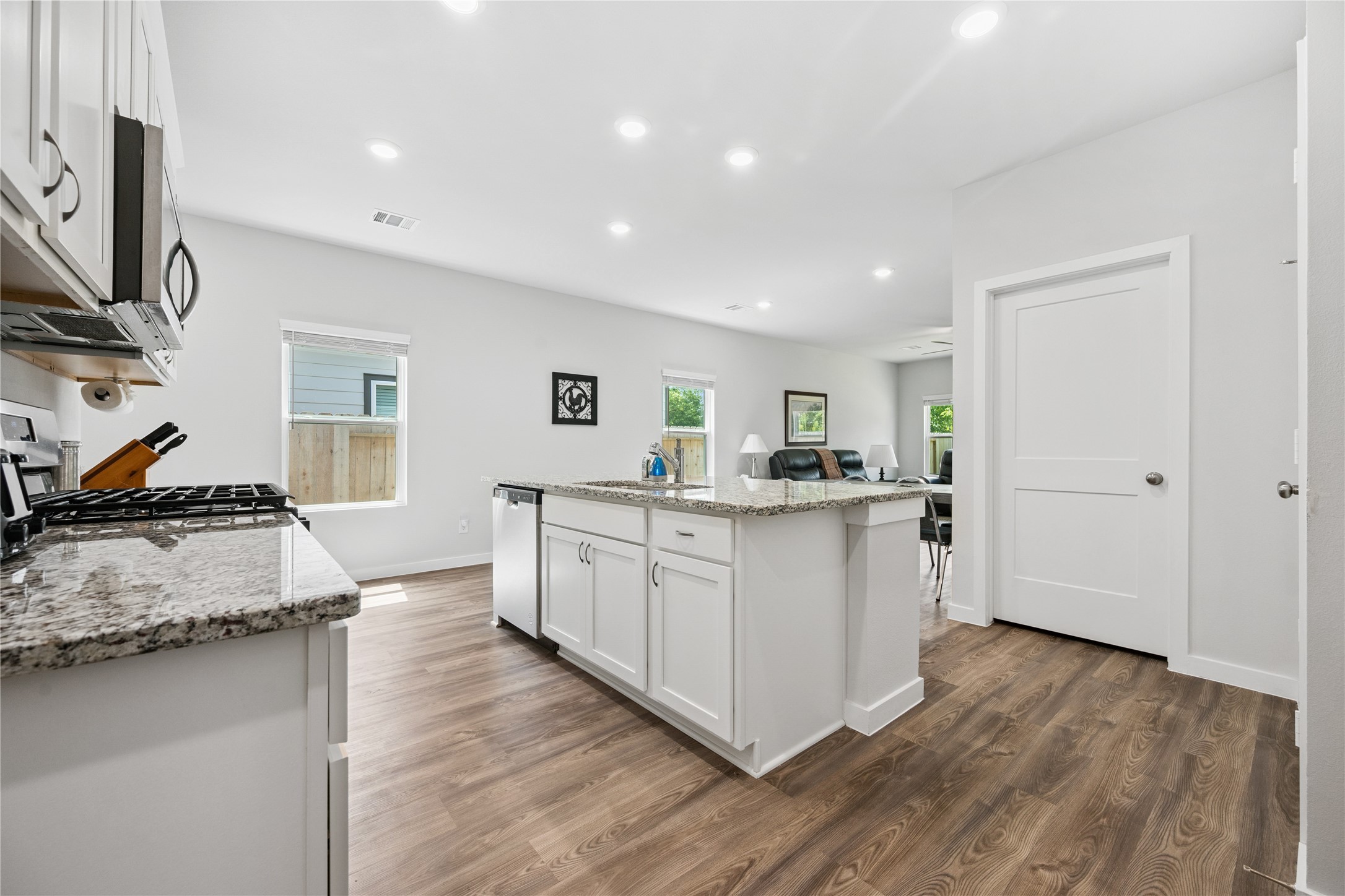16934 Needlepoint Drive Conroe, TX 77302 - Photo 5 of 24 a kitchen with sink and cabinets