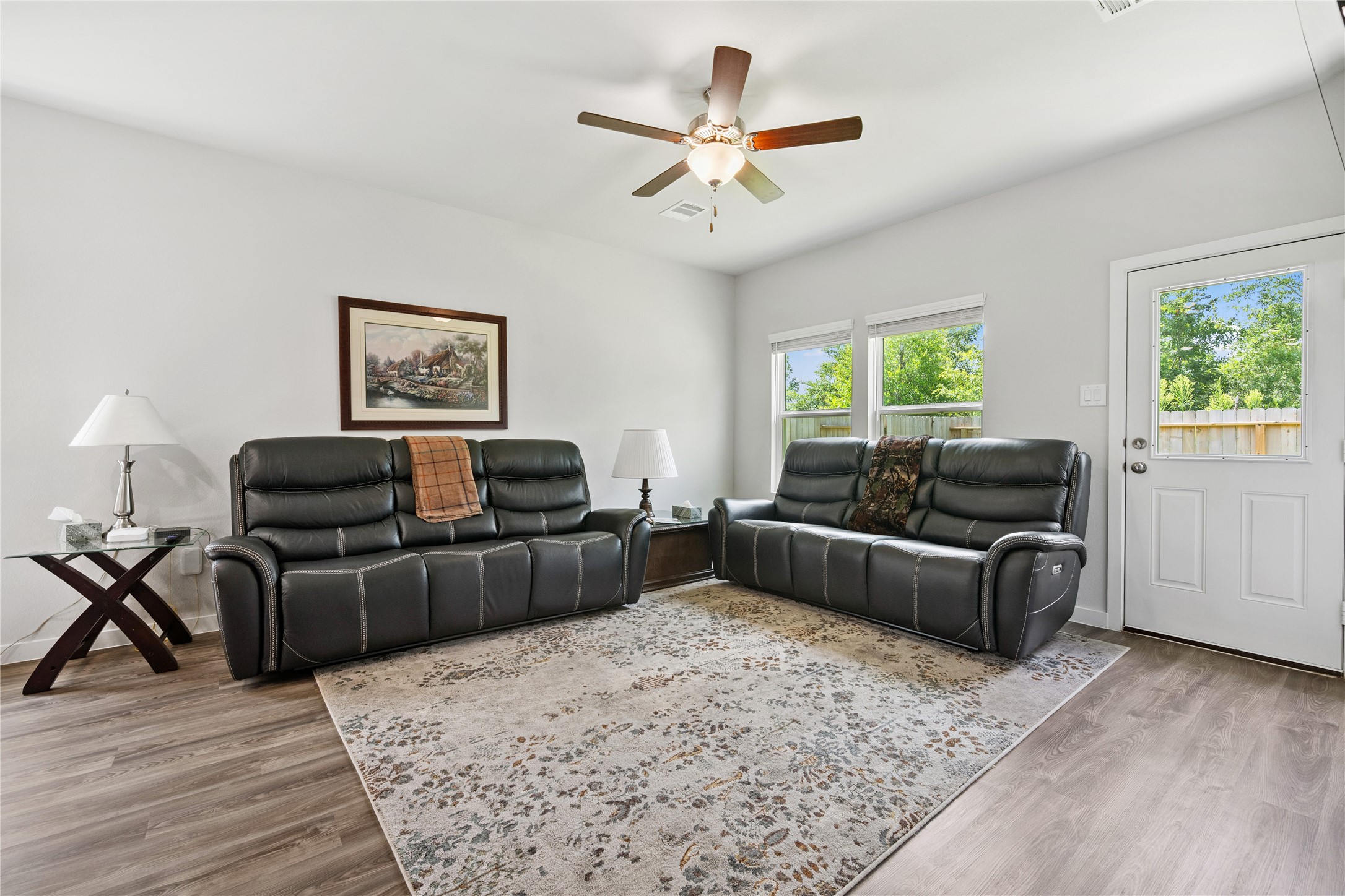 16934 Needlepoint Drive Conroe, TX 77302 - Photo 9 of 24 a living room with furniture and a large window