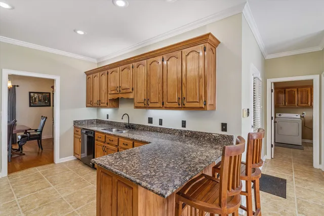 a kitchen that has a cabinets counter space and stainless steel appliances