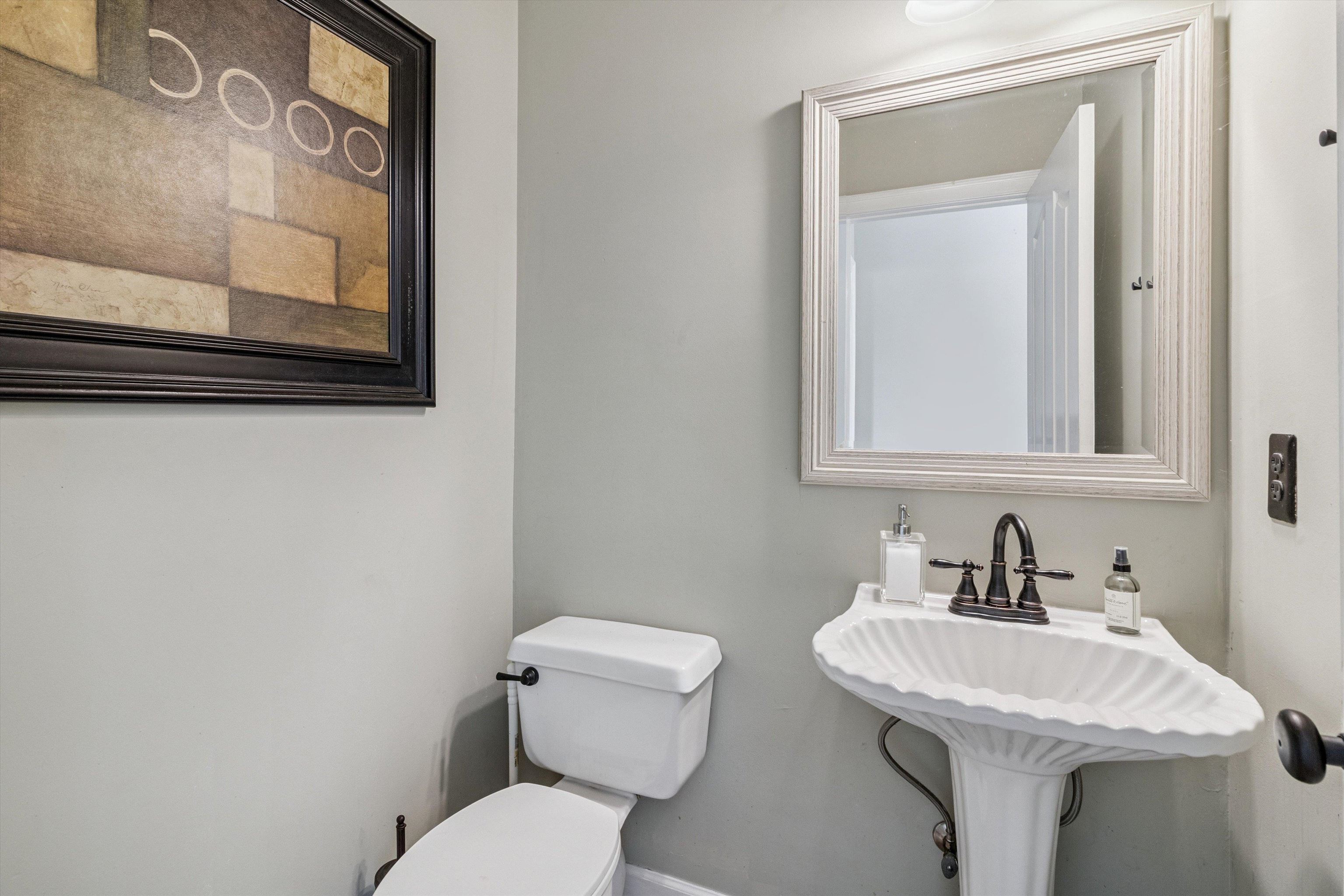 683 Fletcher Road Collierville, TN 38017 - Photo 14 of 30 a bathroom with a toilet sink and mirror