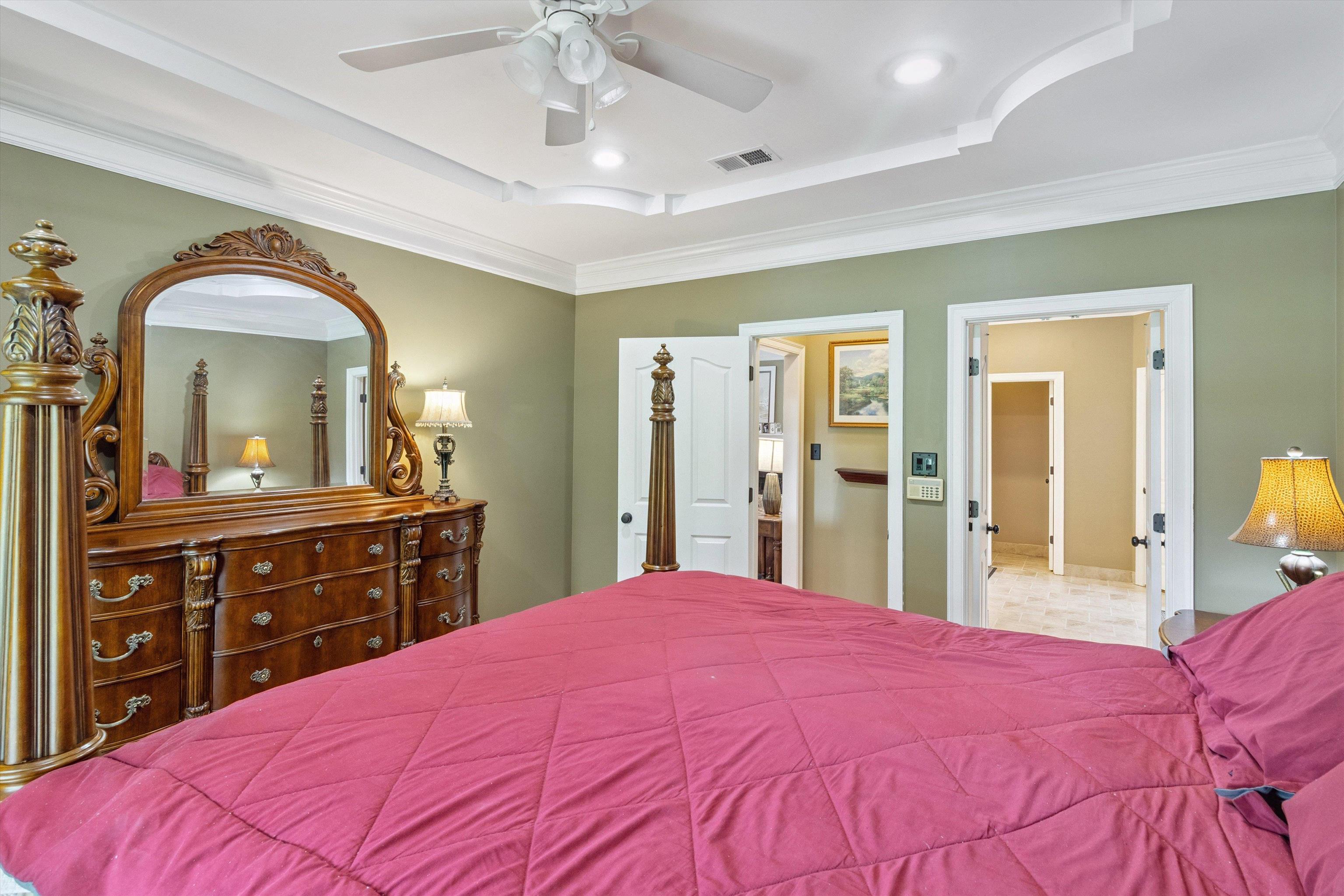 683 Fletcher Road Collierville, TN 38017 - Photo 17 of 30 a bedroom with a large bed and a dresser