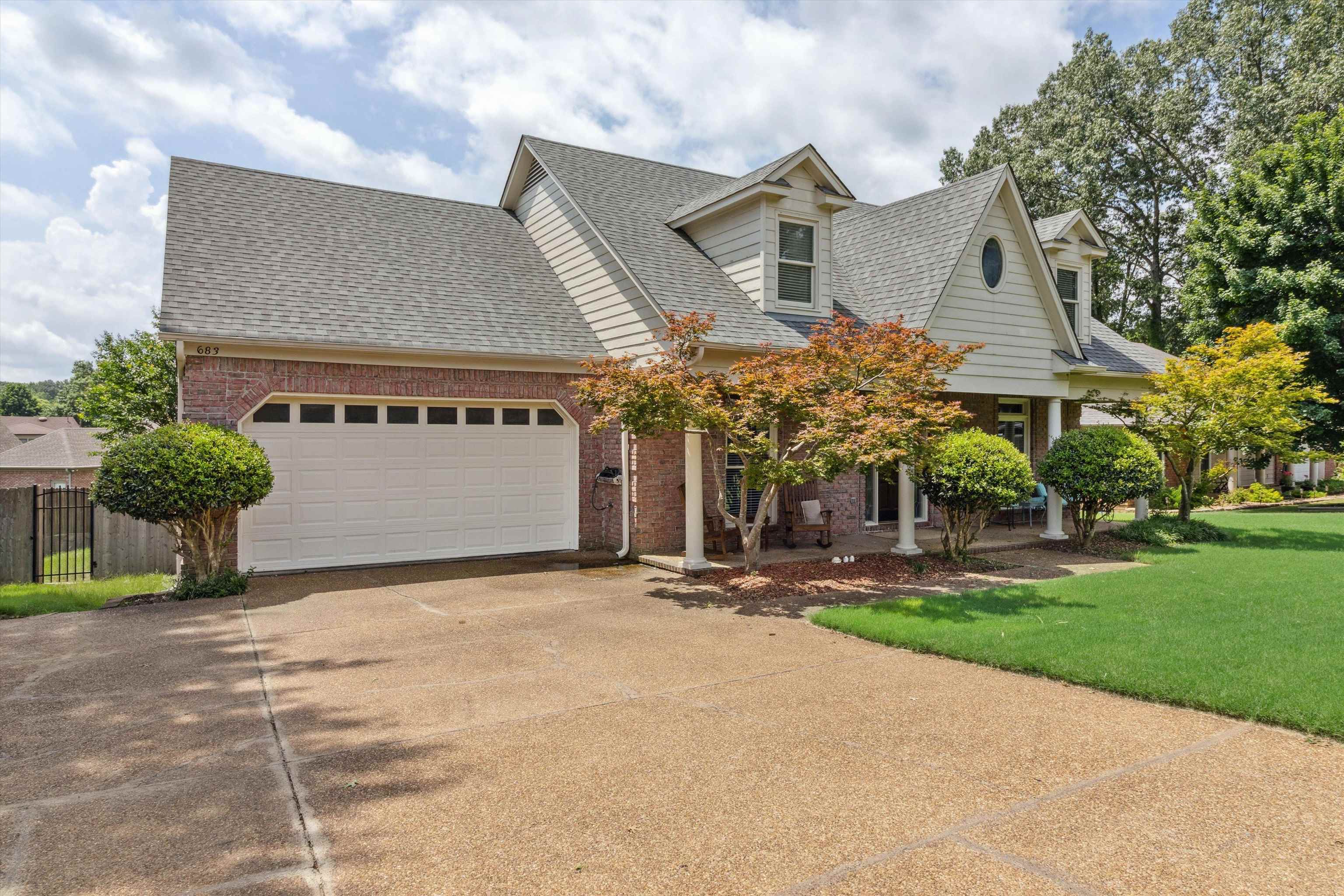 683 Fletcher Road Collierville, TN 38017 - Photo 2 of 30 a front view of a house with a yard and garage