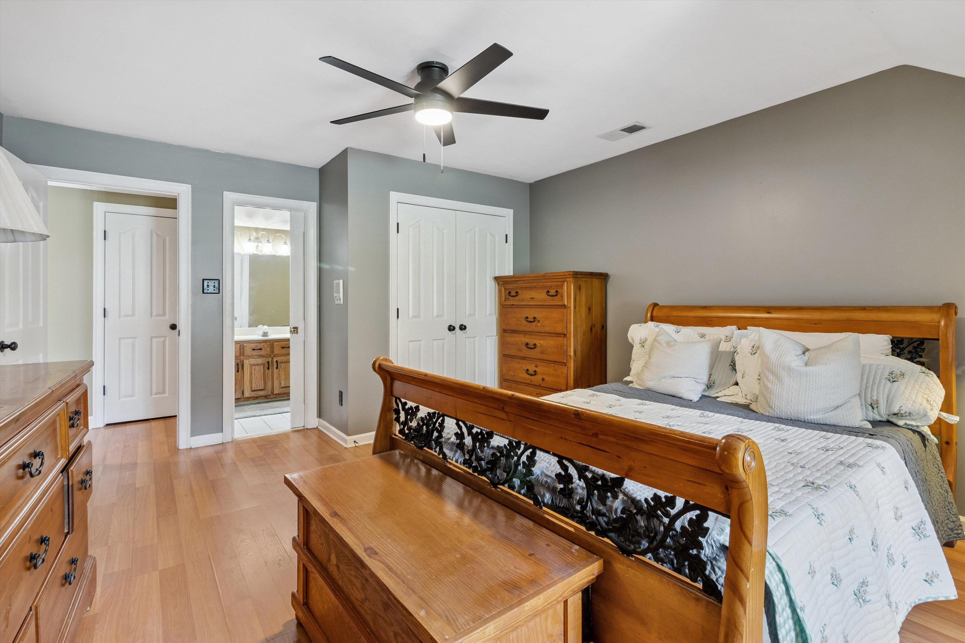 683 Fletcher Road Collierville, TN 38017 - Photo 23 of 30 a bedroom with a bed and wooden floor
