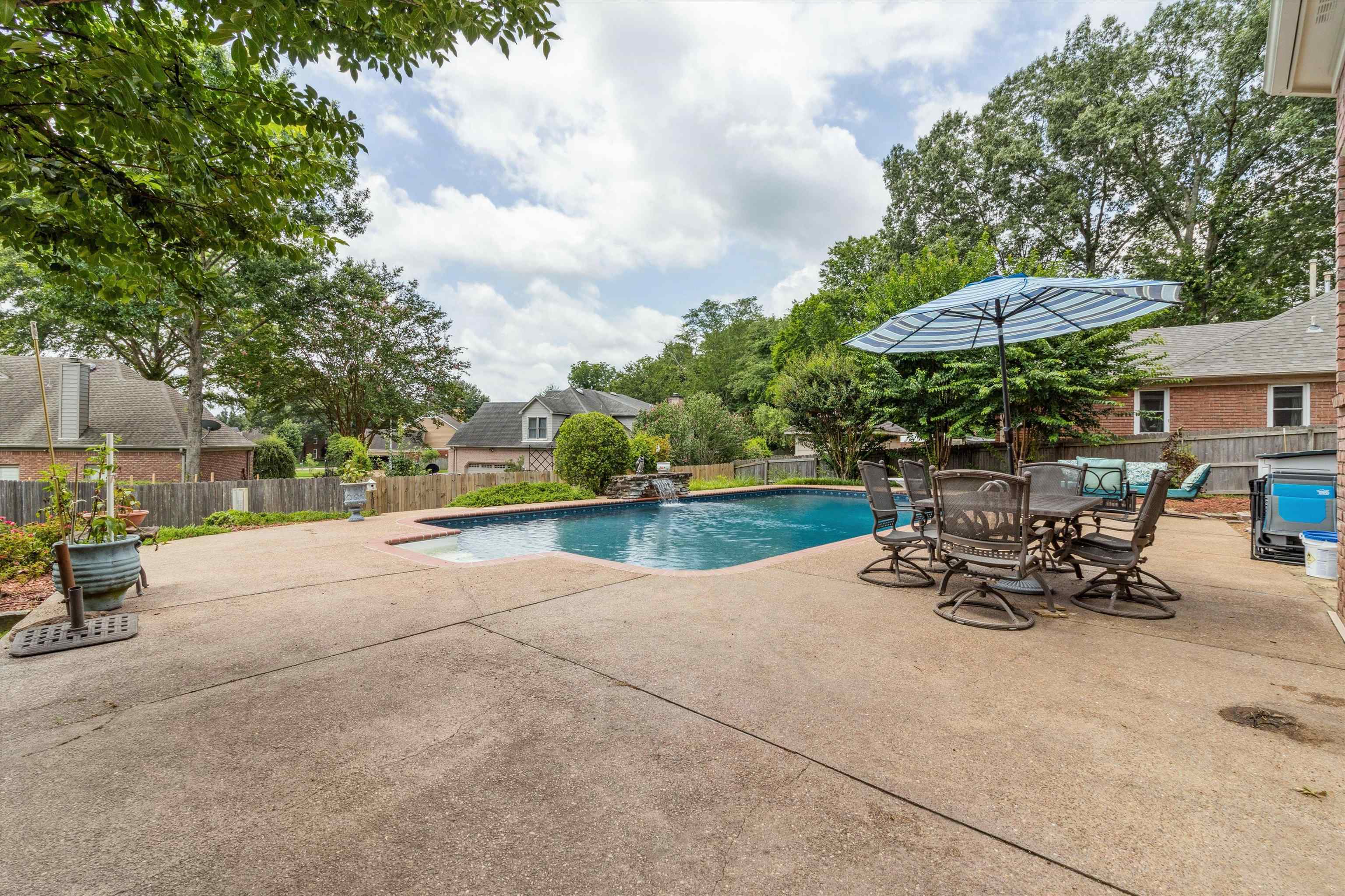 683 Fletcher Road Collierville, TN 38017 - Photo 27 of 30 an outdoor space with patio and white umbrellas