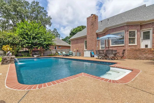 a view of a house with swimming pool