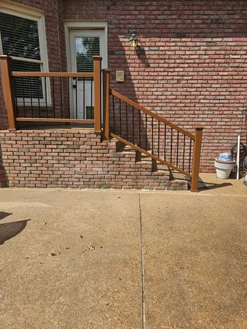 a view of a brick house with a street