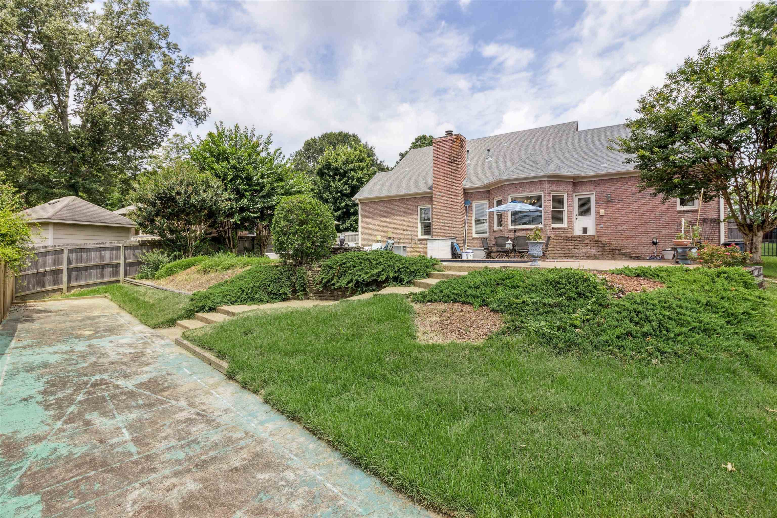 683 Fletcher Road Collierville, TN 38017 - Photo 30 of 30 a front view of a house with a yard and trees