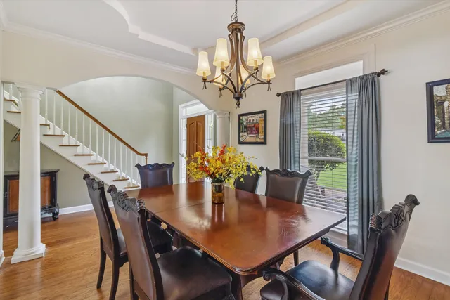 a view of a dining room with furniture window and wooden floor