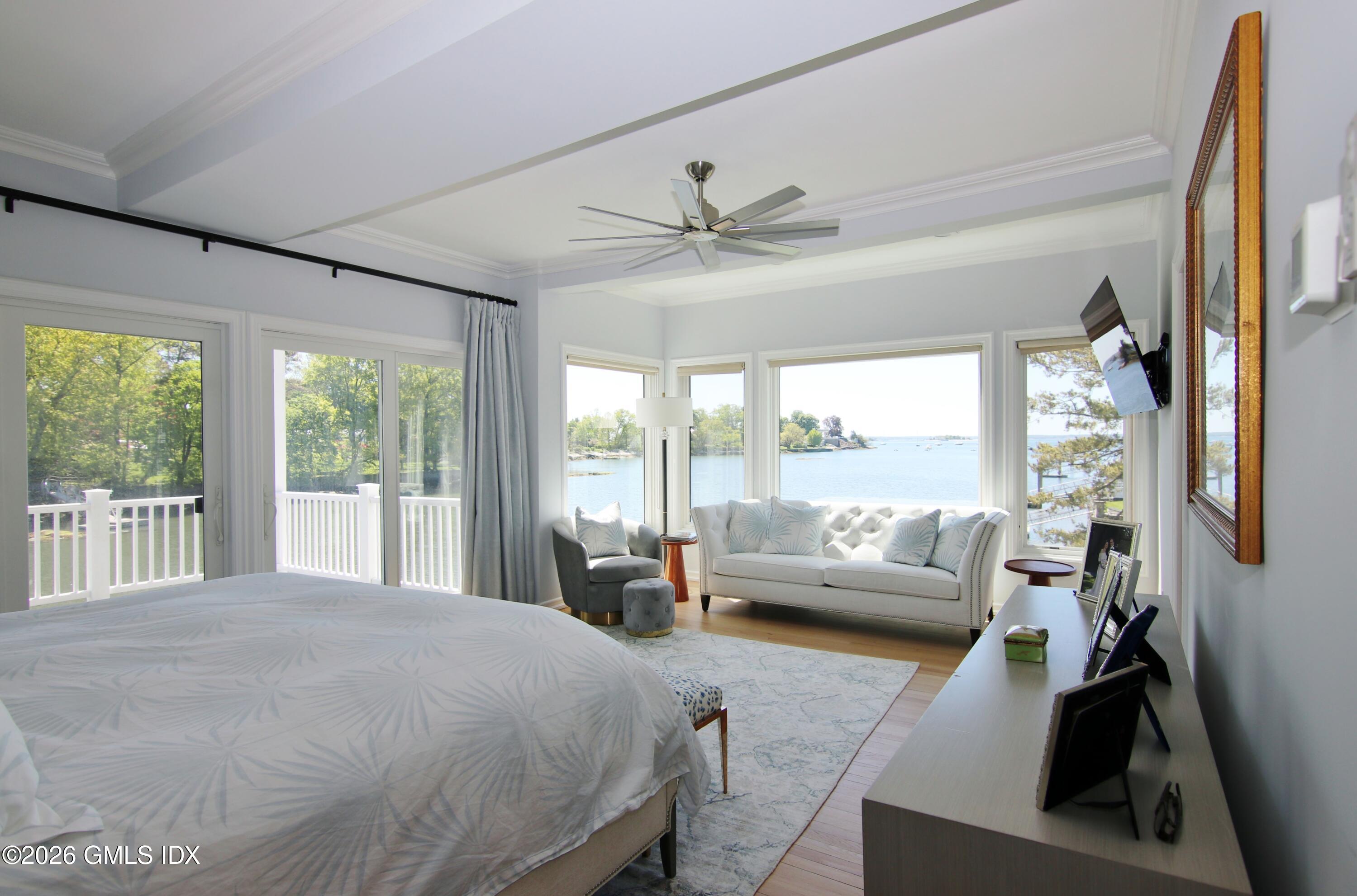 633 Steamboat Road, Unit 5 Greenwich, CT 06830 - Photo 14 of 29 a spacious bedroom with a large bed and a large window