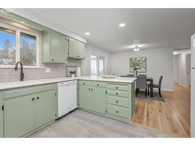 a kitchen with cabinets a sink and dishwasher