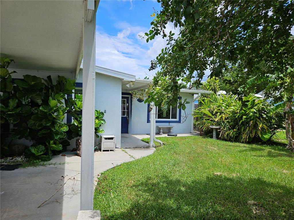 5400 Circle Drive Weeki Wachee, FL 34607 - Photo 2 of 14 a view of a house with a yard and tree