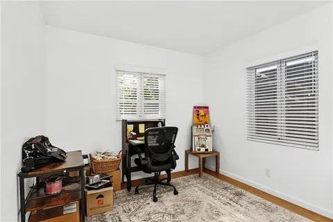 a workspace with furniture and a window