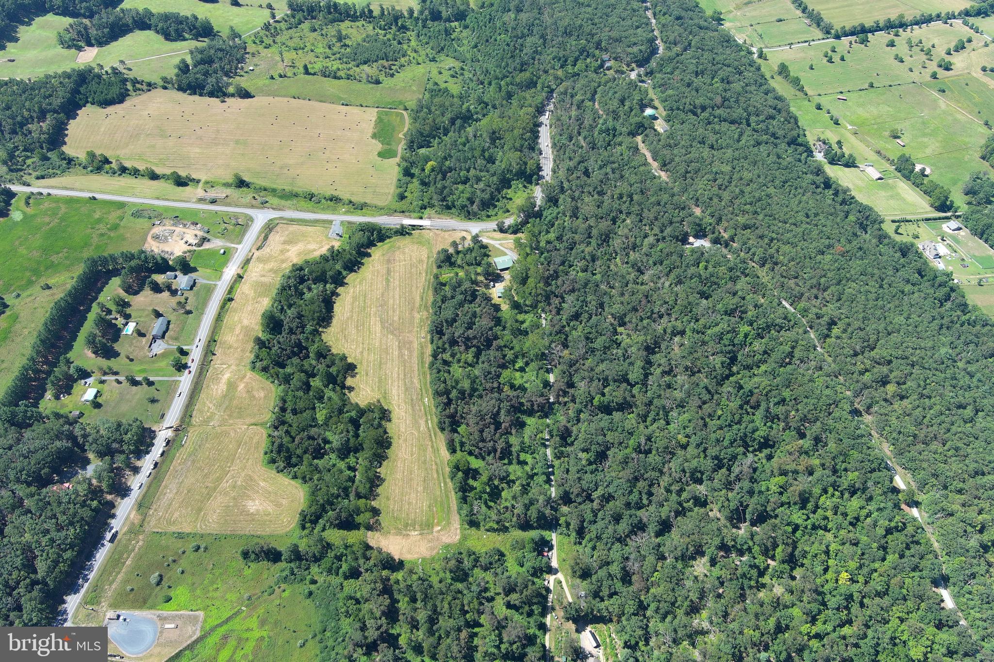 40.955 Ac Intersection Rt 50 & Smokey Hollow Road Bloomery, WV 26817 - Photo 68 of 83 an aerial view of residential house with outdoor space and trees all around