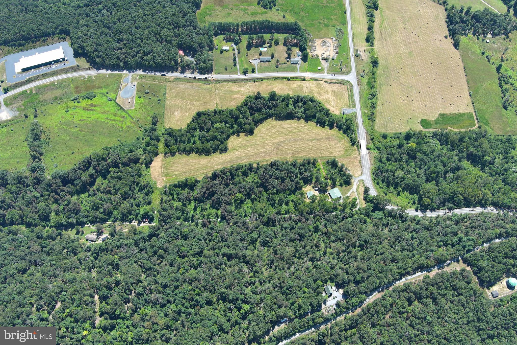 40.955 Ac Intersection Rt 50 & Smokey Hollow Road Bloomery, WV 26817 - Photo 76 of 83 an aerial view of a house with a yard basket ball court and outdoor seating