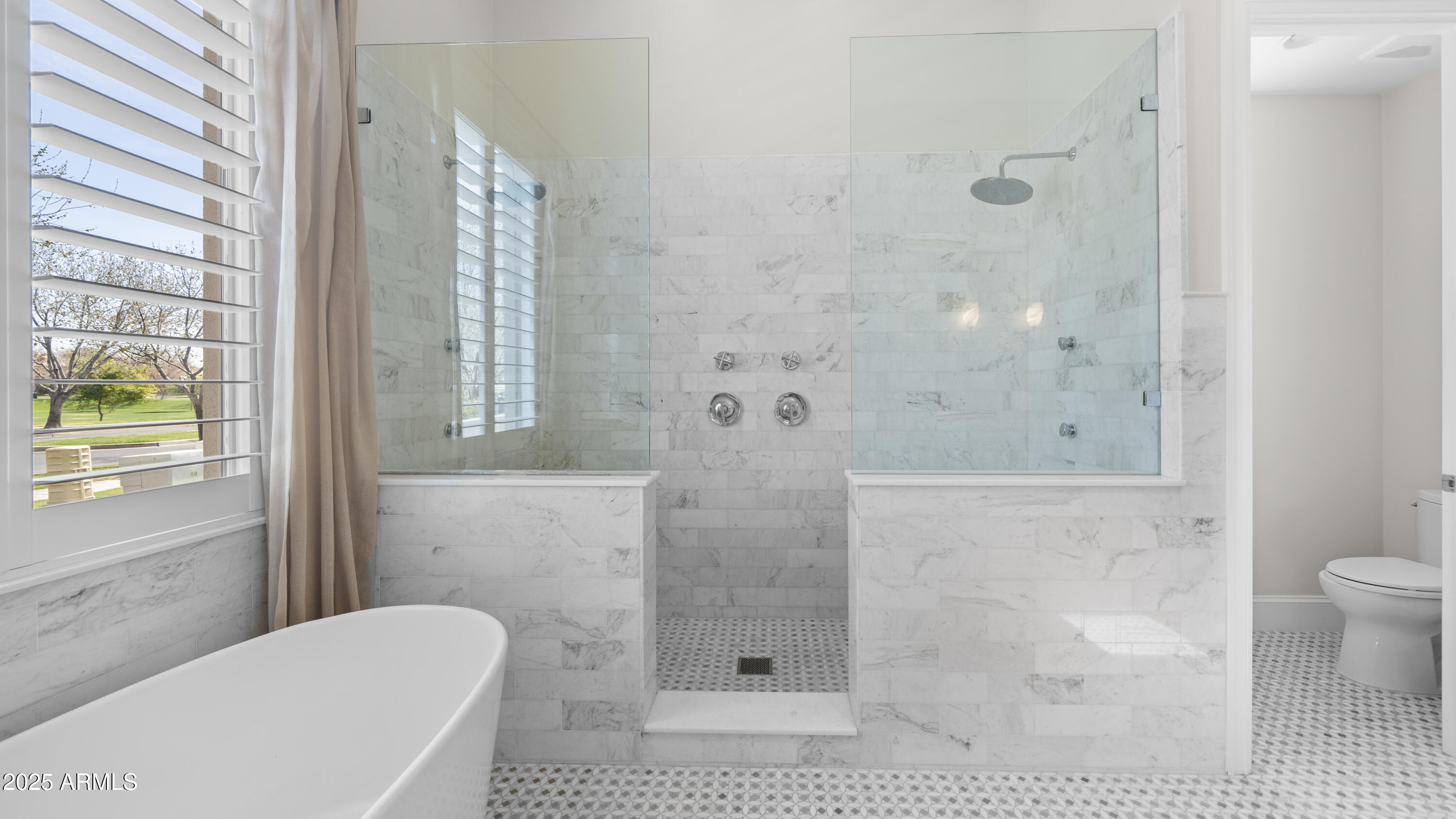 56 South Prairie Road Gilbert, AZ 85296 - Photo 26 of 59 a bathroom with a shower and a toilet
