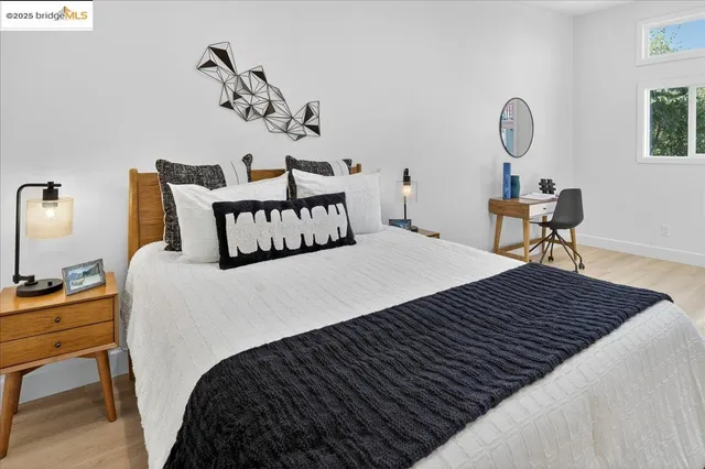 a bedroom with bed and a window