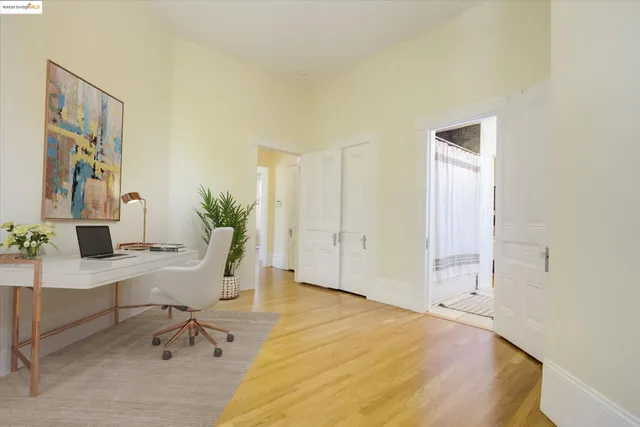 a view of a bedroom with a workspace