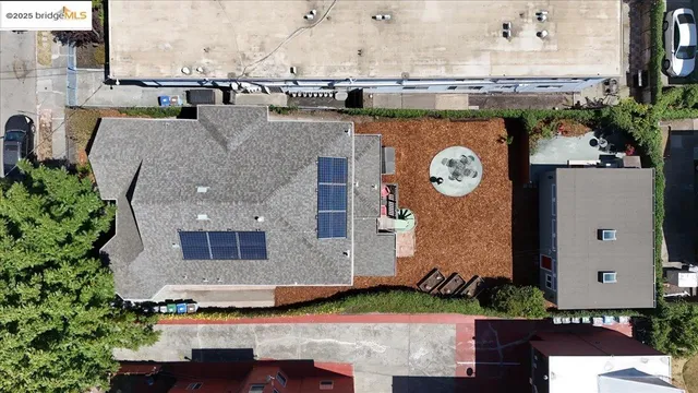an aerial view of a house with yard swimming pool and outdoor seating