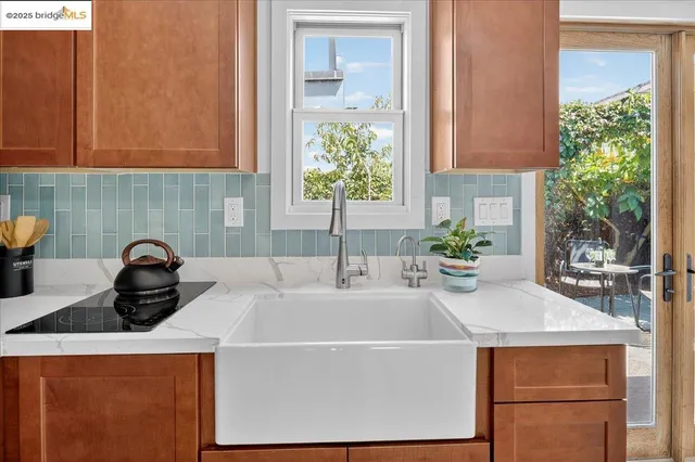 a kitchen with a sink and cabinets