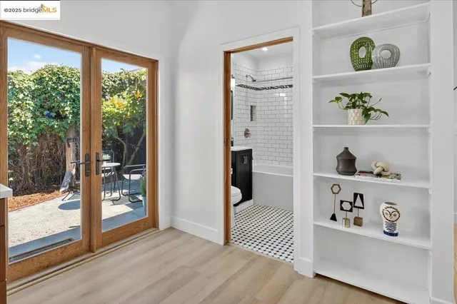 a view of an entryway with wooden floor