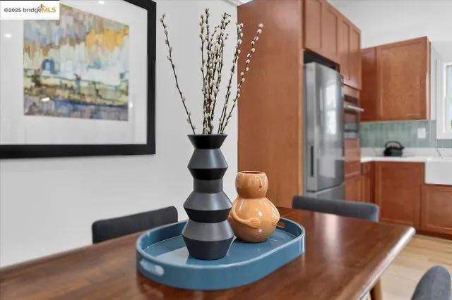 a dining room with furniture and wooden floor