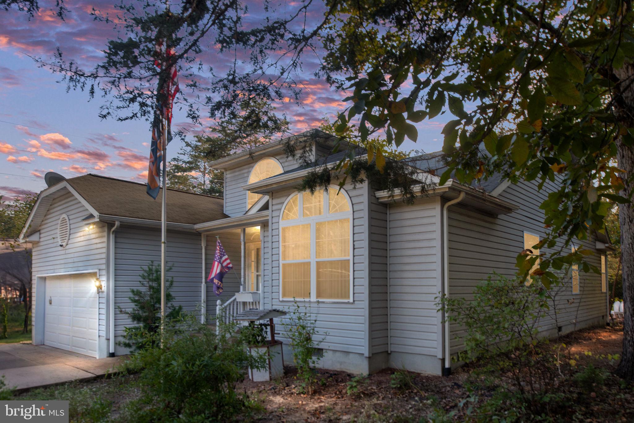 203 Fairfax Lane Locust Grove, VA 22508 - Photo 1 of 54 a front view of a house with garden