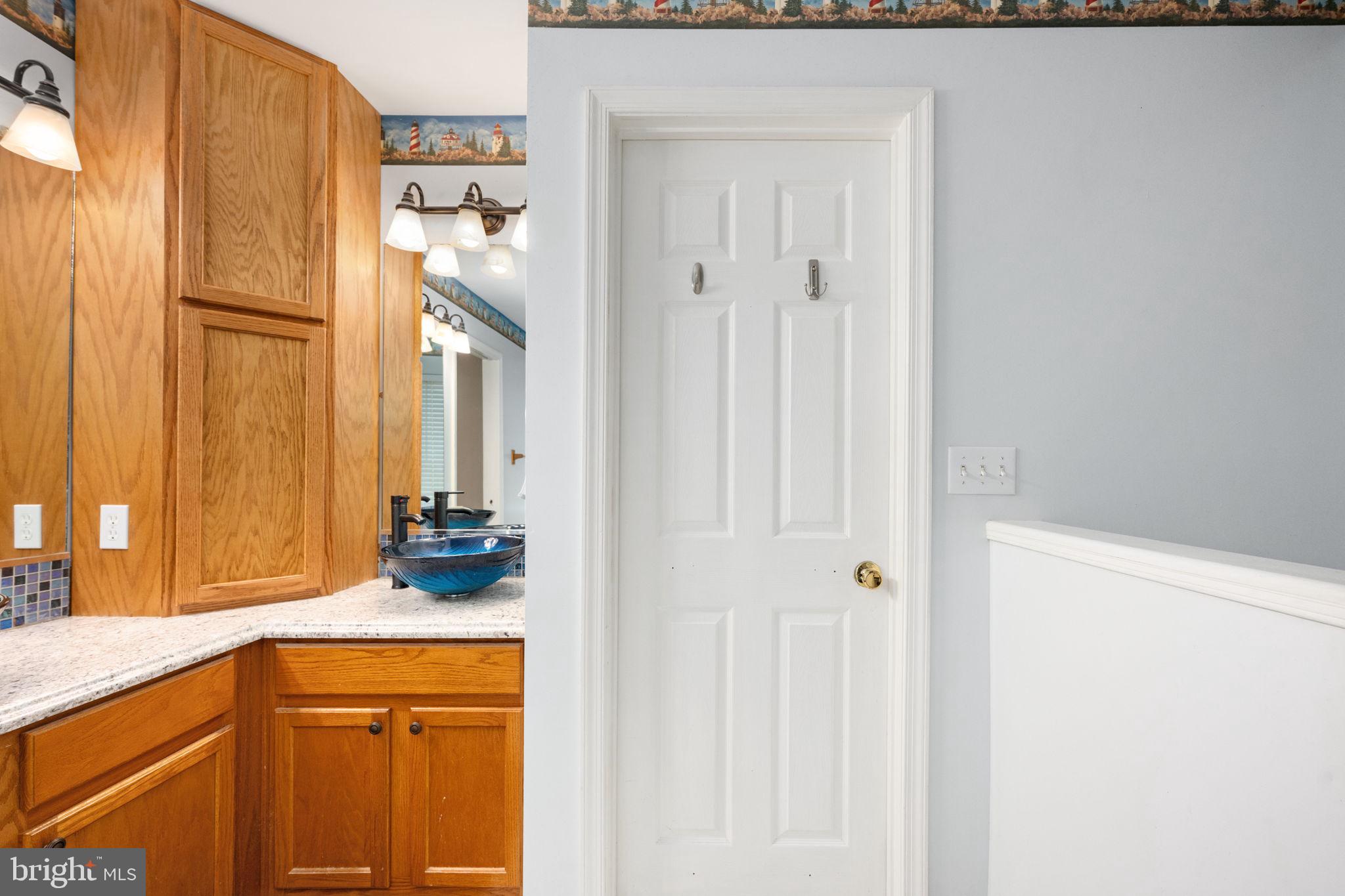 203 Fairfax Lane Locust Grove, VA 22508 - Photo 11 of 54 a bathroom with a sink and a mirror