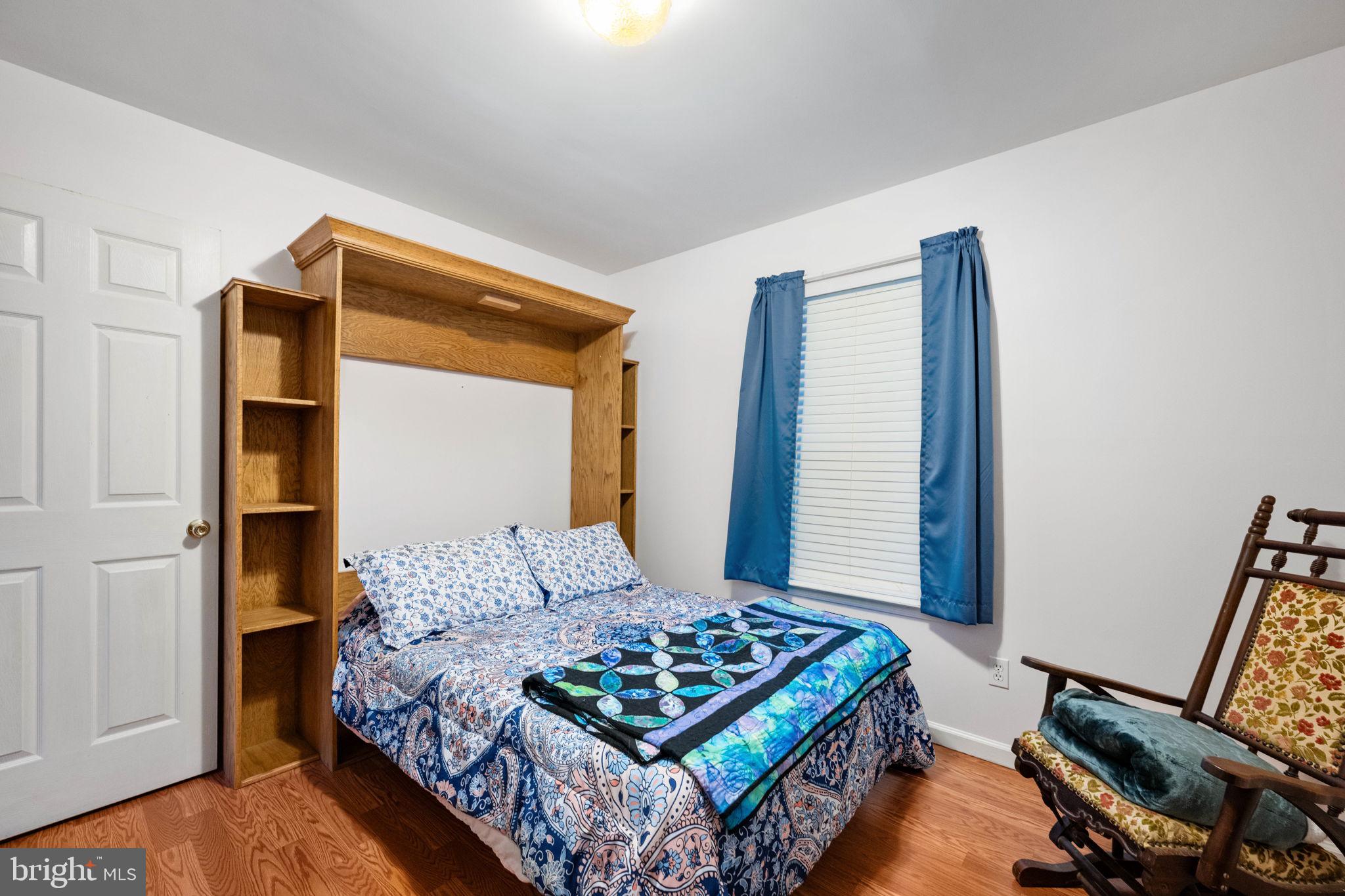 203 Fairfax Lane Locust Grove, VA 22508 - Photo 16 of 54 a bedroom with a bed and a window