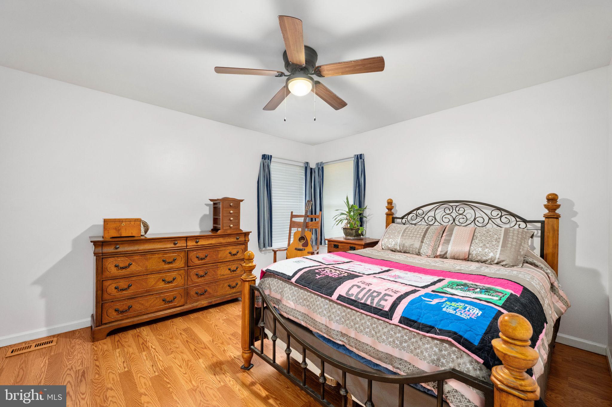 203 Fairfax Lane Locust Grove, VA 22508 - Photo 18 of 54 a bedroom with a bed and a dresser
