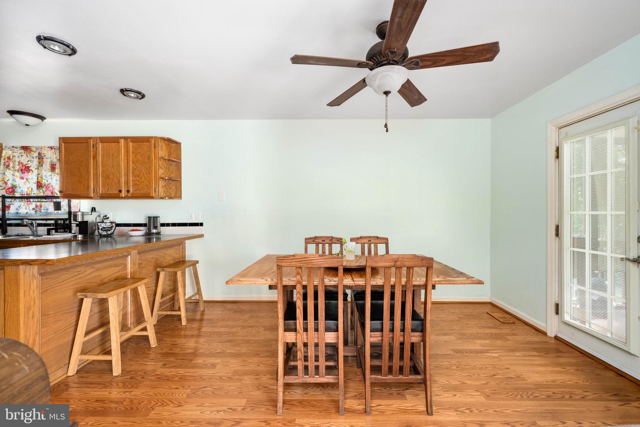 203 Fairfax Lane Locust Grove, VA 22508 - Photo 23 of 54 a view of a dining room with furniture and wooden floor