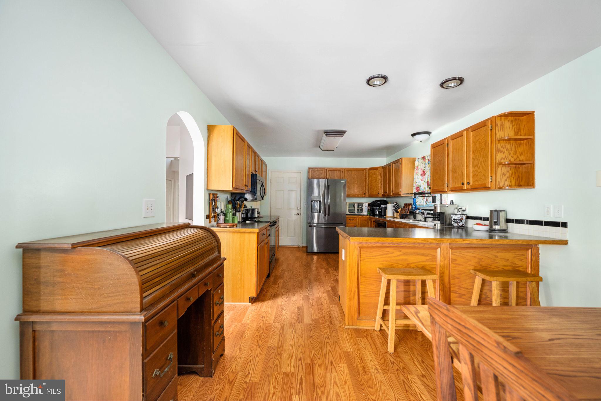 203 Fairfax Lane Locust Grove, VA 22508 - Photo 24 of 54 a living room with furniture a flat screen tv and a sink