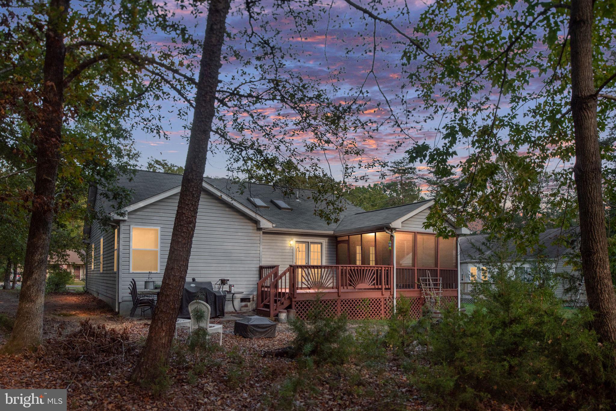 203 Fairfax Lane Locust Grove, VA 22508 - Photo 52 of 54 a backyard of a house with table and chairs