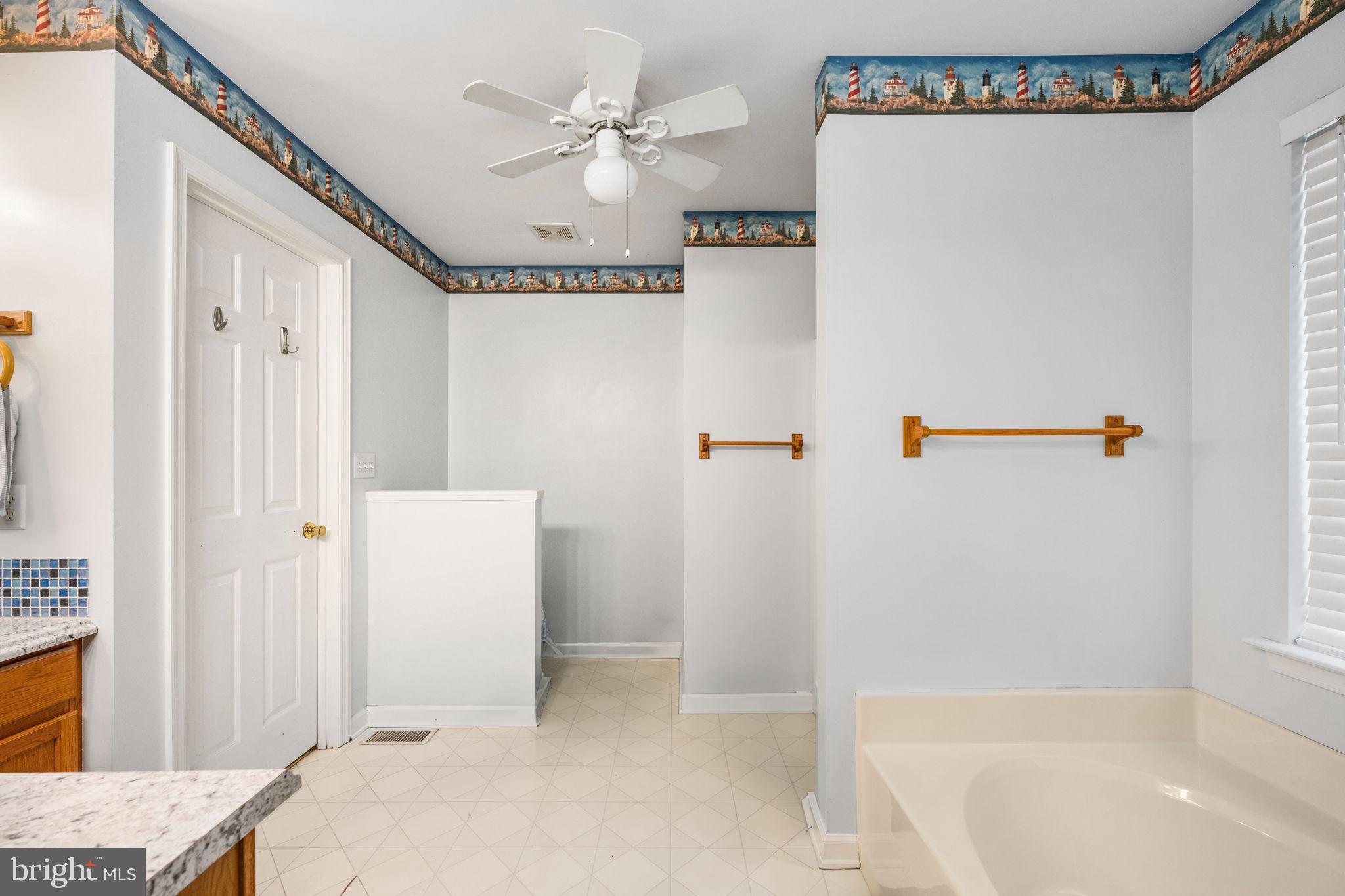 203 Fairfax Lane Locust Grove, VA 22508 - Photo 10 of 54 a bathroom with a bathtub and a shower