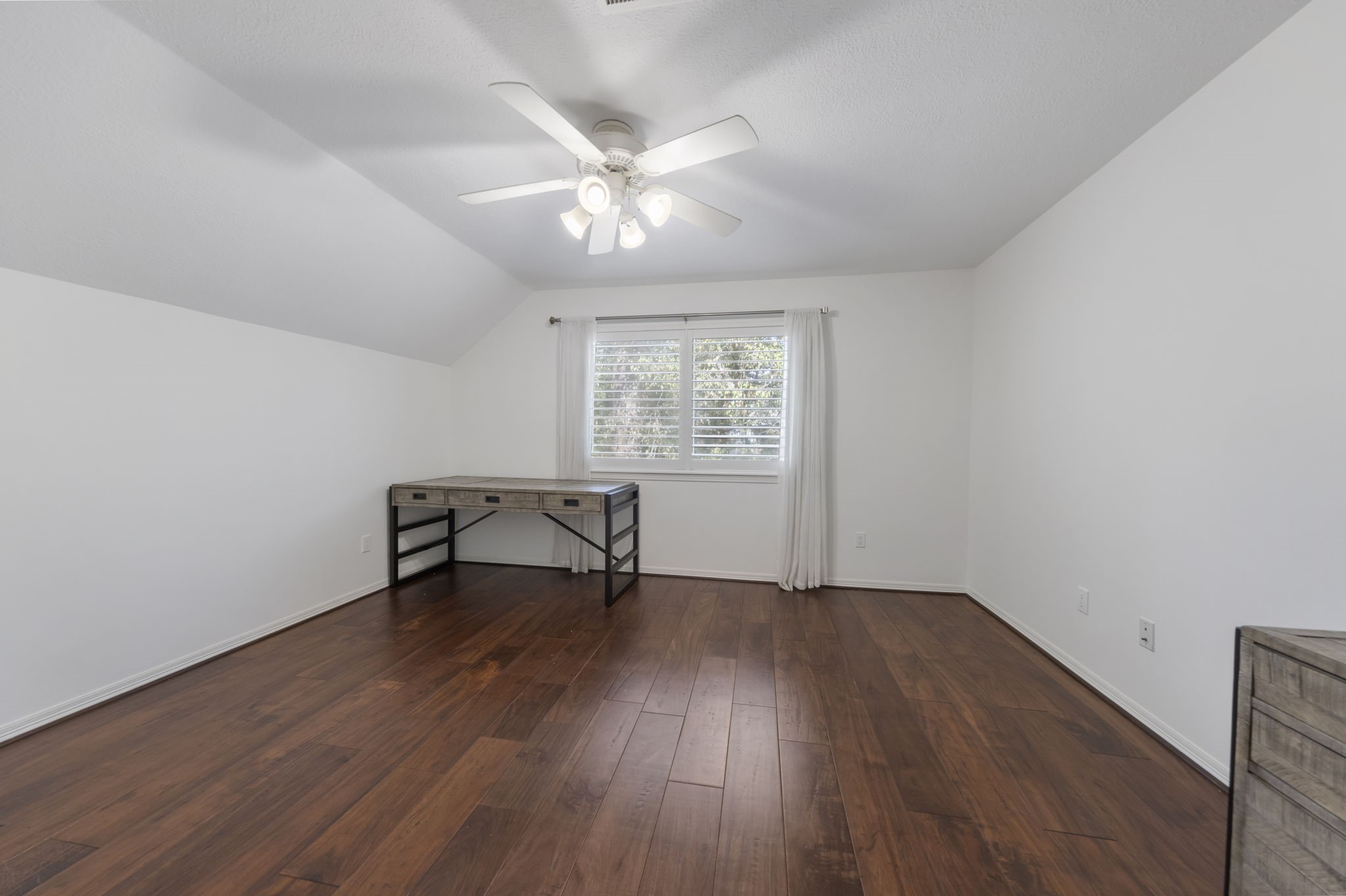 90 West Horizon Ridge Place Spring, TX 77381 - Photo 26 of 36 a view of an empty room with wooden floor and a window