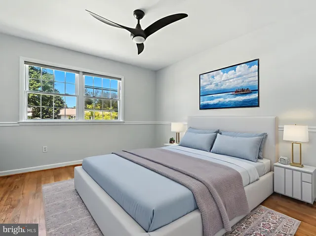 a kitchen with kitchen island granite countertop wooden floors and stainless steel appliances