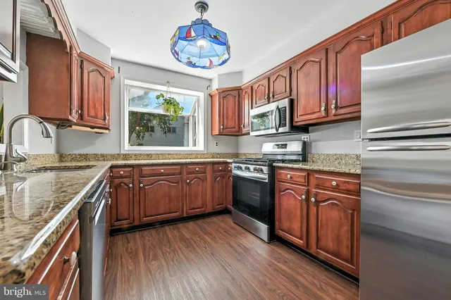 a view of a livingroom with an empty space and a window