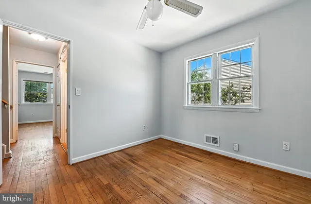 a view of a house with garden and sitting area
