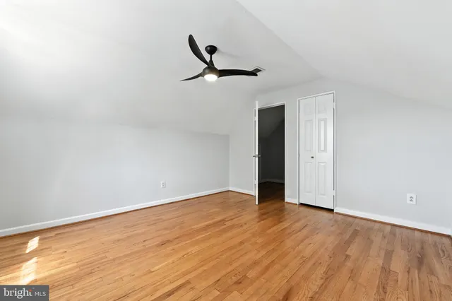 a view of a lake with houses in the back