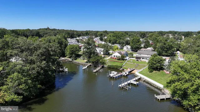 an aerial view of a city with lots of residential buildings lake and ocean view