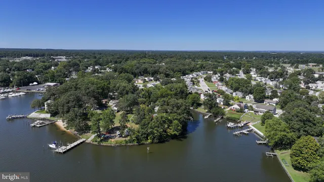 a view of a lake with a house in the background